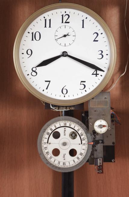 Clocks- 2 (Two) Master: (1) Stromberg Time Corporation, New York, NY, master clock, time only, electrically driven pendulum movement with deadbeat escapement in an oak case with silvered dial with aperture and subsidiary seconds, c1940; (2) Unknown, Germany, master clock, electrically wound brass weight driven movement in an oak case with painted metal dial, subsidiary seconds, c1950.
