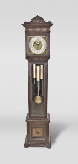 Colonial Clock Company, Zeeland, Mich., chiming hall clock, 8 day, time and strike with Westminster chime playing on tubes, weight driven brass Herschede movement in a walnut case with brass dial, silvered chapter ring with applied brass numerals, and black steel hands