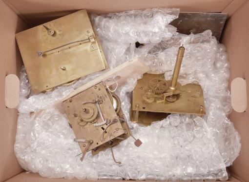 Parts- 5 (Five) English clock parts: (1) English, time only, brass fusee movement with thick plates and an exceptionally long hand shaft; (2) English, time only, brass weight driven movement with thick plates; (3) English, 8 day, time and strike, weight driven brass tall clock movement; (4) English, 8 day, time and strike, weight driven brass tall clock movement with repainted iron dial with bamboo motif; (5) English, 30 hour, time and strike, weight driven brass tall clock movement with painted iron dial signed "G. Hannay / Workington."