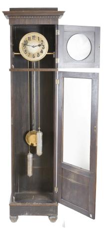 Friedrich Mauthe, Schwenningen, Germany, tall clock, 8 day, time and strike, weight driven brass movement in a dark oak case with frame and panel doors, stepped molded cornice, embossed brass dial with black steel hands.