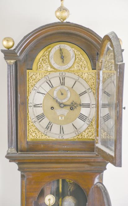 Charles Blanchard, London, England, tall clock, 8 day, time and strike, weight driven movement in a mahogany case on a base with inlaid front panel, the trunk with fluted, canted corners, the hood with broken arch, brass dial with silvered roman numeral chapter ring and applied brass spandrels, matte dial center with engraved plaque with the maker