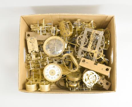 Clock parts- 34 (Thirty-four) brass clock movements including a wide assortment movements, most American, weight and spring driven, 30 hour and 8 day, time only and time / strike by makers such as Chelsea, Seth Thomas, E.N. Welch, Chauncey Jerome, New Haven, Waterbury, and Ansonia. Lot also includes an unusual unsigned American fusee movement and a couple of French movements.