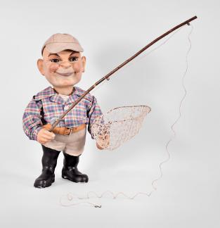 West Germany, clockwork advertising nodder figure, spring driven motor powering an up-and-down head motion, the paper-mâché fisherman figure with painted cast plaster of Paris head and hands, pivoted glass eyes, tailored shirt, leather belt with buckle, and felt cap, holding a fishing net in one hand and a wooden fishing rod in the other. 
