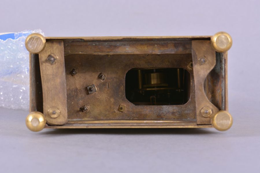 France, mantel timepiece, 8 day, time only, spring driven brass movement with thread suspension in a stepped, molded brass base upon which stands the cast gilt figure of the goddess Athena holding a spear in one hand, the other hand holding a shield within which is set a silvered chapter ring with roman numerals, blued steel Breguet style hands.