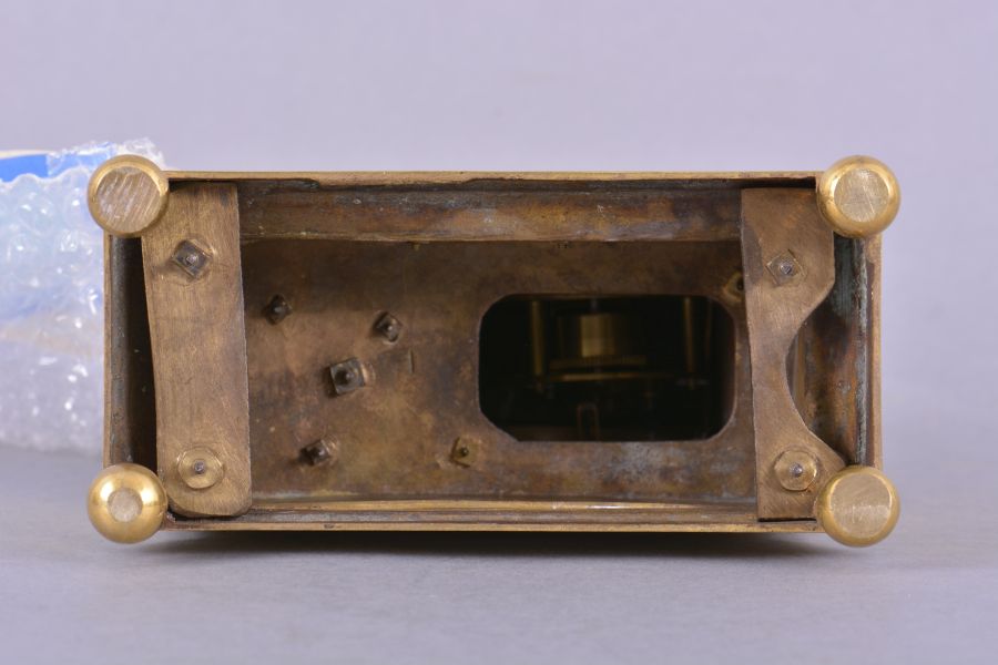 France, mantel timepiece, 8 day, time only, spring driven brass movement with thread suspension in a stepped, molded brass base upon which stands the cast gilt figure of the goddess Athena holding a spear in one hand, the other hand holding a shield within which is set a silvered chapter ring with roman numerals, blued steel Breguet style hands.