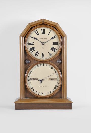 Seth Thomas Clock Co., Thomaston, Conn., "Parlor Calendar No. 5" shelf clock with a spring driven 8 day time and strike movement and a R. T. Andrews patented perpetual calendar mechanism in a walnut case.