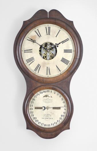 Ithaca Calendar Clock Co., Ithaca, NY, "No. 4 Hanging Office" wall clock with a spring driven 30 day timepiece movement (E.N. Welch) with a H. B. Horton patented perpetual calendar mechanism in a walnut case.