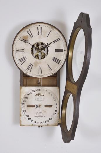 Ithaca Calendar Clock Co., Ithaca, NY, "No. 4 Hanging Office" wall clock with a spring driven 30 day timepiece movement (E.N. Welch) with a H. B. Horton patented perpetual calendar mechanism in a walnut case.