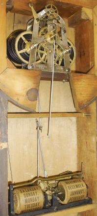 Ithaca Calendar Clock Co., Ithaca, NY, "No. 4 Hanging Office" wall clock with a spring driven 30 day timepiece movement (E.N. Welch) with a H. B. Horton patented perpetual calendar mechanism in a walnut case.