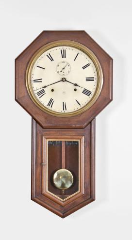 Seth Thomas Clock Co., Thomaston, Conn., "World" long drop octagon wall clock with a spring driven 8 day time and strike movement in a mahogany case.
