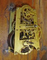 E.N. Welch Mfg. Co., Forestville, Conn., "Star Pointer" wall clock with a spring driven time and simple calendar movement in an oak case.