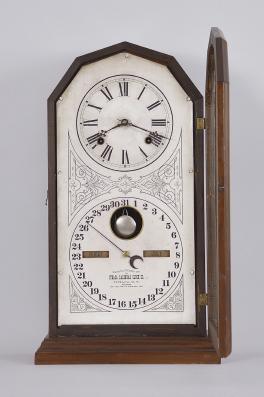 Ithaca Calendar Clock Co., Ithaca, NY "No. 11 Octagon" double dial calendar shelf clock with a spring driven 8 day time and strike movement (E.N. Welch) and a H. B. Horton patented perpetual calendar mechanism in a walnut case.