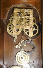 F. Kroeber Clock Co., New York, NY, "Polaris" 8 day, time and strike spring driven brass movement walnut shelf clock with a nicely made shelf.