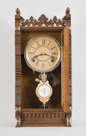F. Kroeber Clock Co., New York, NY, "Polaris" 8 day, time and strike spring driven brass movement walnut shelf clock with a nicely made shelf.