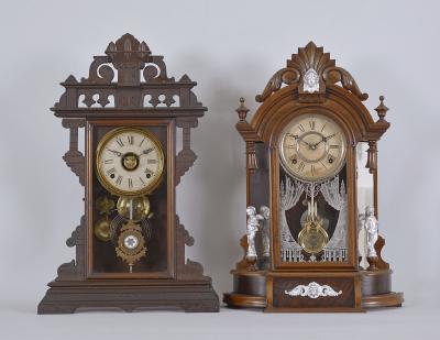 Clocks- 2 (Two): (1) E.N. Welch Manufacturing Co., Forestville, Conn., "Eclipse" shelf clock with a spring driven 8 day time, strike and alarm movement in a walnut case, c1885. (2) William L. Gilbert, Winsted, Conn., "Occidental" shelf clock with a spring driven 8 day time and strike movement in a walnut case with burl accents and mirror sides, c1891.