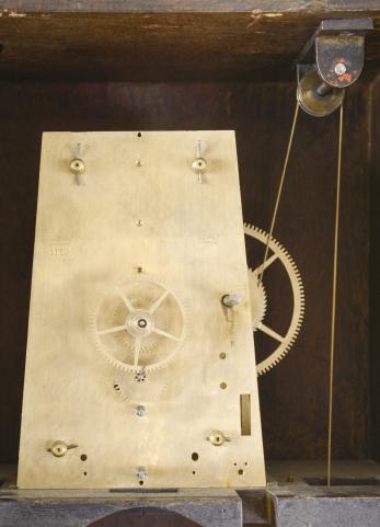 Clocks- 2 (Two): (1) Howard & Davis, Boston, Mass., "Watch Clock", softwood case with simple molded base, inset panels in base and trunk door and molded cornice, roman numeral white painted metal dial, brass 8 day timepiece movement with trapezoidal plates and turned pillars, ebonized wooden pendulum rod, damascened, brass clad, cast iron pendulum bob, and brass clad weight, c1860; (2) E. Howard & Co., Boston, Mass., hanging watch clock similar to the No. 26, rectilinear walnut case with molded cornice and applied crest, the door with molded glazed aperture for viewing the time recorder mechanism, roman numeral white painted metal dial, damascened 8 day timepiece movement, wooden pendulum rod with damascened brass clad pendulum bob, and cast iron weight, c1875.