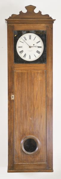 Clocks- 2 (Two): (1) Howard & Davis, Boston, Mass., "Watch Clock", softwood case with simple molded base, inset panels in base and trunk door and molded cornice, roman numeral white painted metal dial, brass 8 day timepiece movement with trapezoidal plates and turned pillars, ebonized wooden pendulum rod, damascened, brass clad, cast iron pendulum bob, and brass clad weight, c1860; (2) E. Howard & Co., Boston, Mass., hanging watch clock similar to the No. 26, rectilinear walnut case with molded cornice and applied crest, the door with molded glazed aperture for viewing the time recorder mechanism, roman numeral white painted metal dial, damascened 8 day timepiece movement, wooden pendulum rod with damascened brass clad pendulum bob, and cast iron weight, c1875.