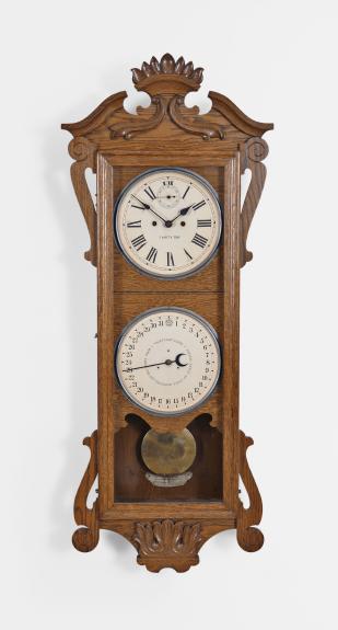 New Haven Clock Co., New Haven, Conn., Unidentified model, 30 day, spring driven brass double wind movement double dial wall calendar clock. We did not find this model in the catalog as it may have been a special order as New Haven did produce clocks for other firms such as the American Ringer Co., New York.