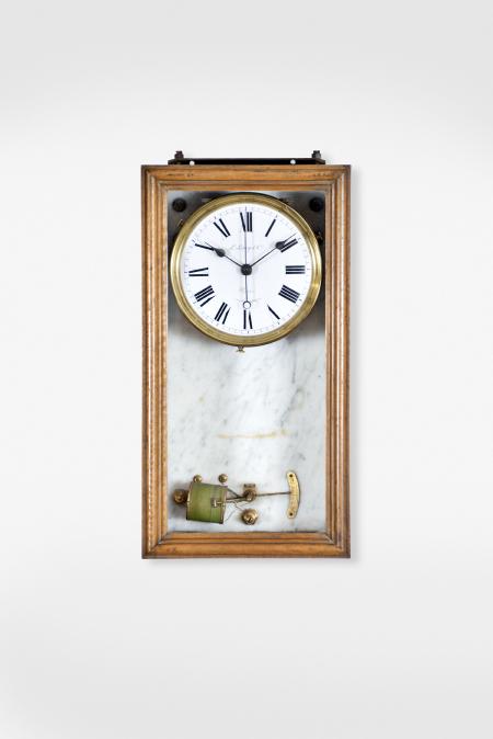 Clock parts, including an Electrique Brillie hanging clock with molded wooden case and marble backboard, the white enamel dial signed "L. Leroy & Co., a Paris", a "Wizard" coin operated trade stimulator in a black mantel case, and a crystal regulator style case for an unknown electric movement