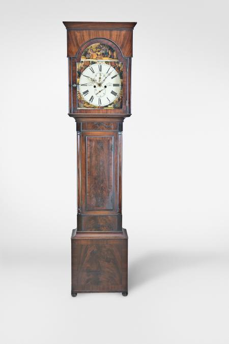Clocks- 2 (Two) Tall: (1) J.B. & R. Twiss, Montreal, Canada, early 19th century 30 hour wooden movement tall clock, base in the Hepplewhite style with scalloped skirt between tall straight bracket feet, trunk with rectangular thumb molded door, the bonnet with turned columns and broken arch pediment and central urn finial, arabic numeral white painted dial with gilt spandrels with polychrome floral decoration matching that in the arch, blued steel Terry style hands; (2) John Aitken, Dalry, Scotland, a second quarter 19th century mahogany and mahogany veneer tall clock, crotch veneered base with mahogany cross-banding and on compressed ball feet, the trunk with turned quarter columns flanking a crotch veneered door also with mahogany cross-banding, flat top bonnet with projecting cornice, and glazed break arch door, roman numeral white painted dial with polychrome spandrels depicting the constituents of the United Kingdom, the arch with hunting scene titled "Death of the Stag", pierced and chased brass Scottish hands, 8 day, weight driven time and strike movement.
