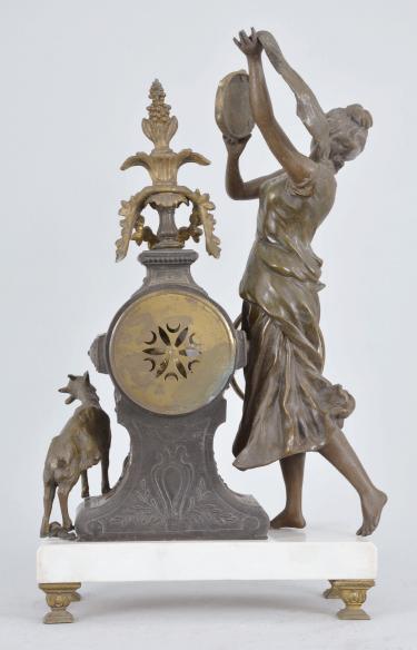 Fritz Marti & Fils, Paris, France, "Esmérelda" figural mantel clock, 8 day, time and strike, spring driven pendule de Paris movement, the case on cast feet supporting a polished white marble base, a goat figure on one side and a dancing woman with tambourine on the other, the clock with applied metal ornaments, arabic numeral white enamel dial with polychrome garlands in the center, blued steel hands.