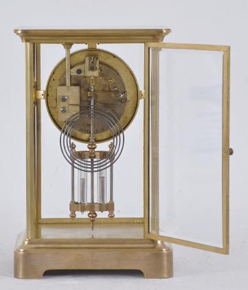Japy Frères & Cie., Paris, France, for Spaulding & Co., Chicago, crystal regulator, 8 day, time and strike, spring driven pendule de Paris movement with compensating pendulum in a glazed polished brass case, cast bezel, arabic numeral white enamel dial, and blued steel hands.