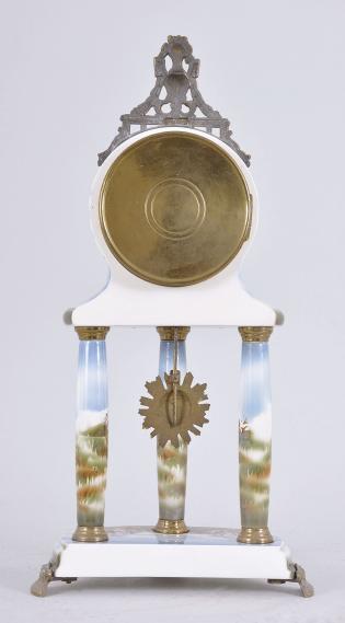 Japy Frères & Cie, Paris, France, mantel timepiece, 8 day, time only, spring driven movement in a polychrome ceramic case, the base on three cast metal feet, three columns supporting the clock decorated with mythical scenes and topped by a cast urn crest piece, arabic numeral white enamel dial and black steel hands.