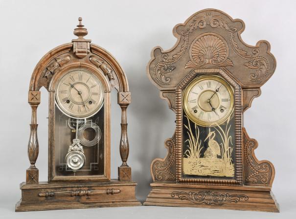 Clocks- 2 (Two): (1) Ansonia Clock Co., New York, unidentified shelf clock with a spring driven 8 day time and half hour strike movement in a walnut case. c.1890. (2) E.N. Welch Mfg. Co., Forestville, Conn., "Assortment F- No.32" shelf clock with a spring driven 8 day time and strike movement in a walnut case, c1901.