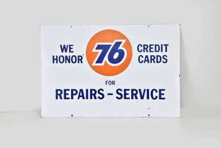 Gas station double sided enamel sign reading "We Honor Credit Cards for Repairs- Service" in blue letters on a white background, the bold orange circle with "76" in blue letters