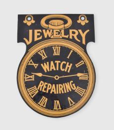 Watchmakers two sided enamelled trade sign, the sheet iron ground enamelled in orange and black, and depicting a pocket watch with roman numerals, spade hands, and dial marked "Watch Repairing", the top of the sign with two holes for hanging flanking the bow and crown, and the word "Jewelry" in an arc between crown and case