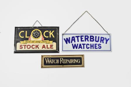 Trade signs- 3 (Three), the first a cobalt blue cased glass sign, the blue etched to clear and leaving "Waterbury Watches and a narrow blue border, with two holes for hanging, with chain, the next an easel back frame containing a reverse painted glass with black ground, gilt border, and "Watch Repairing in gilt letters, and a polychrome painted sheet metal sign from the Waterbury Brewing Company, the sign marked "Clock Stock Ale Best At Any Time", the "O" in clock with clock dial marked "Waterbury Brewing Company", Waterbury Watches sign dimensions listed