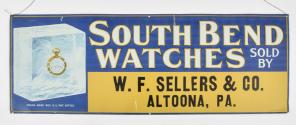 Trade signs- 2 (Two), the first a lithographed sheet metal sign advertising South Bend pocket watches, the predominant colors blue and yellow, with image of a South Bend watch in a block of ice, and announcing "South Bend Watches Sold By W. F. Sellers & Co., Altoona, Pa., the other a blue and white, two sided enamel sign, "Agents For Ingersoll Watches And Clocks", enamel sign dimensions listed
