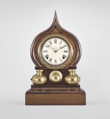 E. Ingraham & Co., Bristol, Conn., "Oriental" shelf clock with a spring driven 8 day time and strike movement in a rosewood veneered case.