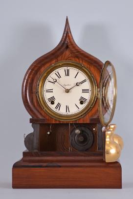 E. Ingraham & Co., Bristol, Conn., "Oriental" shelf clock with a spring driven 8 day time and strike movement in a rosewood veneered case.