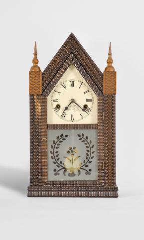 Forestville Manufacturing Co., J.C. Brown, Bristol, Conn., 30 hour, time and strike spring driven brass movement ripple front mini sharp gothic or steeple clock.