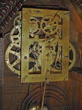Forestville Manufacturing Co., J.C. Brown, Bristol, Conn., 30 hour, time and strike spring driven brass movement ripple front mini sharp gothic or steeple clock.