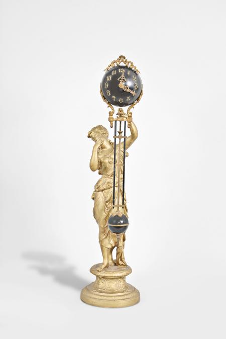 Ansonia Clock Co., New York, NY, "Juno" figural swinging clock, 8 day, time only, spring driven movement mounted inside a blue painted sphere with applied cast ribbon ornament, applied arabic numerals and Louis XV style hands, all supported by patinated spelter figure of a Roman goddess standing atop a pedestal.