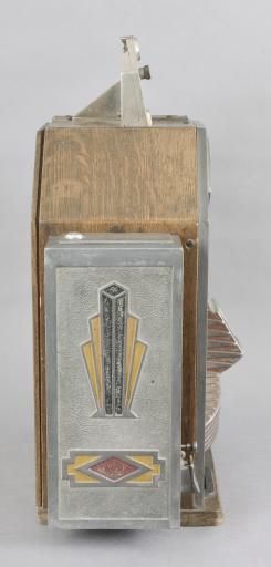 Jennings & Co., Chicago, Illinois, “Little Duke” Penny Slot Machine with classic Art Deco styling, three window jack pot display with fruit on rotating wheel, nickel plated case with polychrome painted highlights and quarter sawn oak rear, sides and bottom including a rare side gum vendor