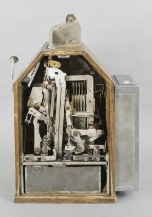 Jennings & Co., Chicago, Illinois, “Little Duke” Penny Slot Machine with classic Art Deco styling, three window jack pot display with fruit on rotating wheel, nickel plated case with polychrome painted highlights and quarter sawn oak rear, sides and bottom including a rare side gum vendor