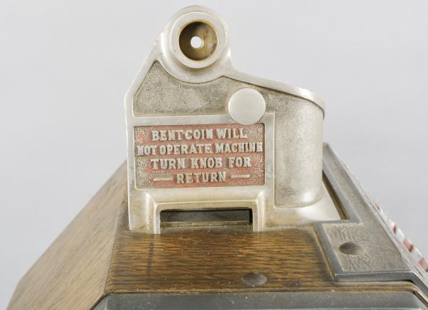 Jennings & Co., Chicago, Illinois, “Little Duke” Penny Slot Machine with classic Art Deco styling, three window jack pot display with fruit on rotating wheel, nickel plated case with polychrome painted highlights and quarter sawn oak rear, sides and bottom including a rare side gum vendor