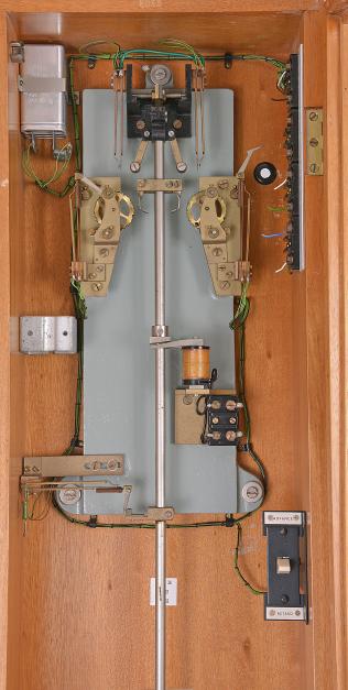Gents, Leicester, a GPO #36 MK6 master clock, rectilinear hardwood case with rounded corners and glazed door, movement with heavy cast iron back plate, fitted with two count wheels, and contacts at the top of the pendulum sending pulses at one, six, and thirty second intervals, pendulum with heavy cylindrical bob and Hipp toggle, and weight for fine timing, the inner left side of case with two brackets for retaining the pendulum rod while in transit