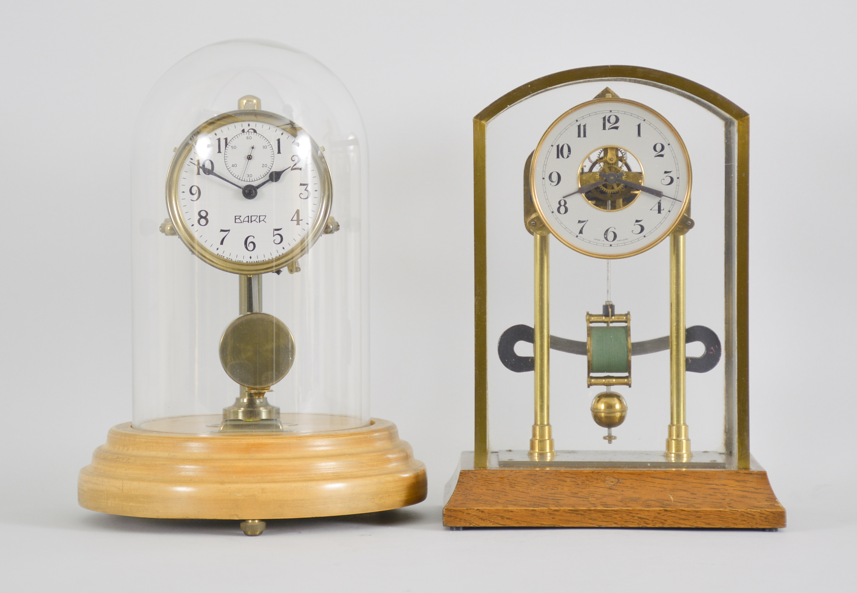 Two early electromechanical clocks, one English made and one Barr