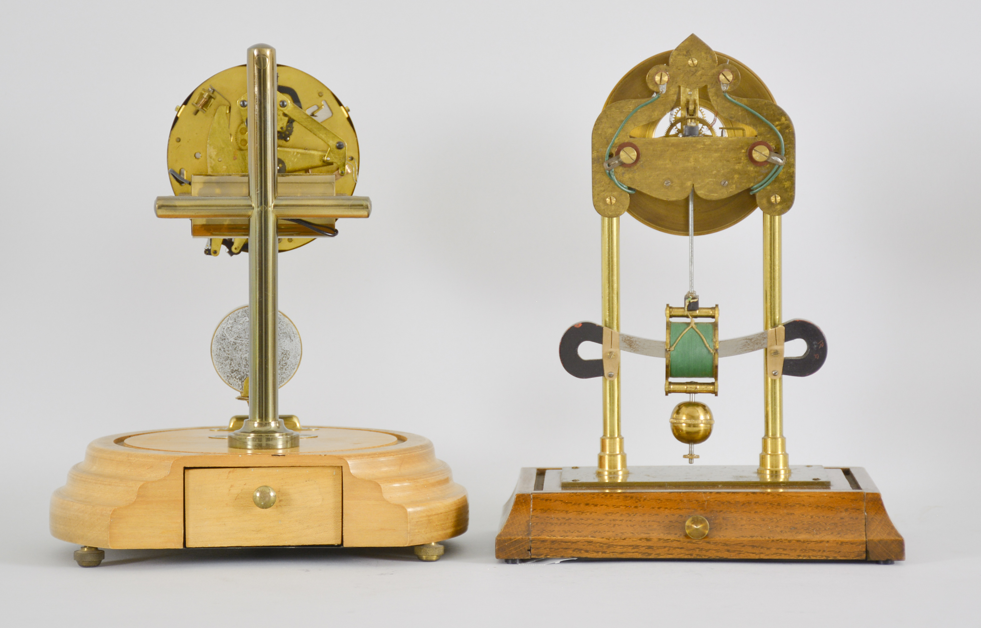 Two early electromechanical clocks, one English made and one Barr