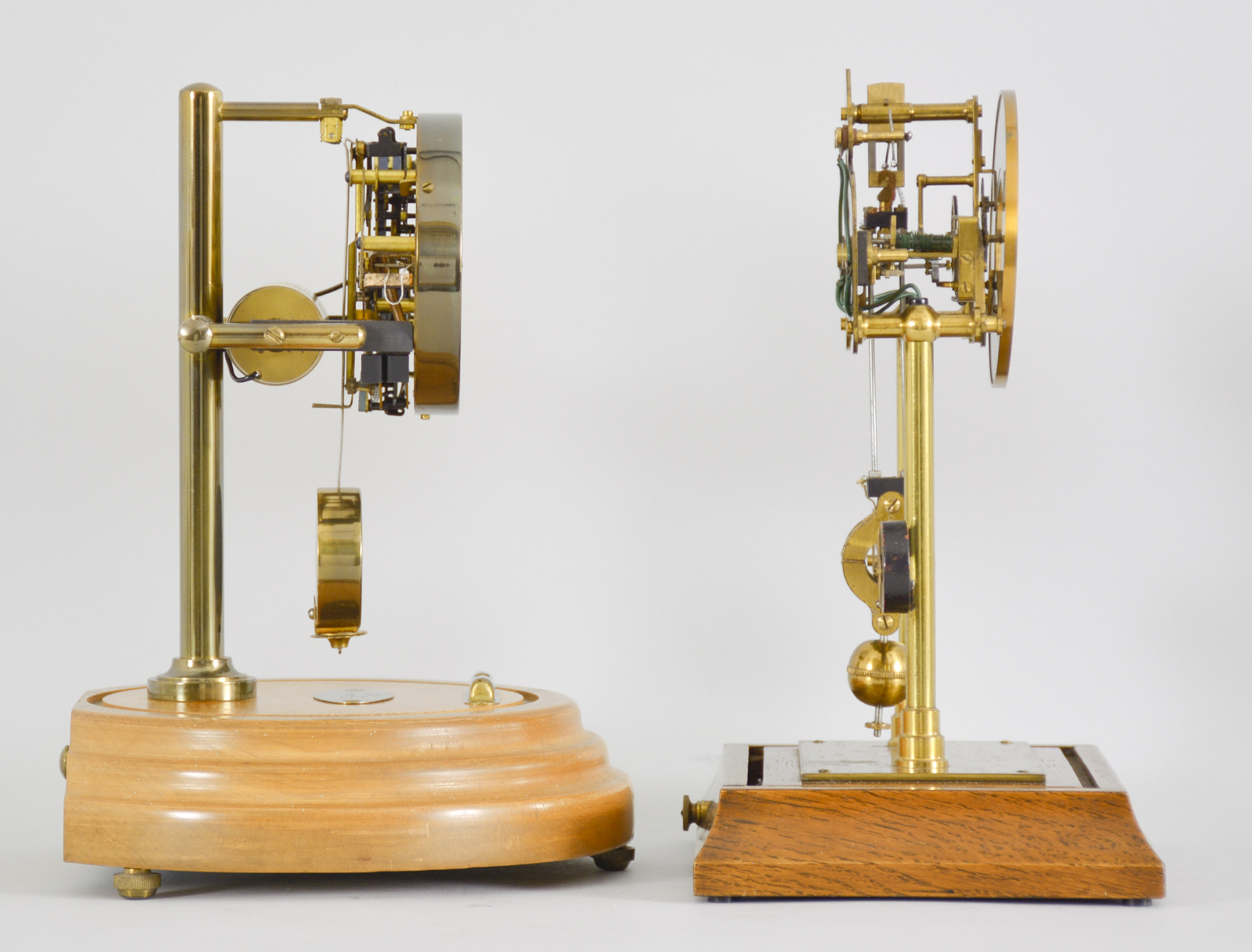 Two early electromechanical clocks, one English made and one Barr