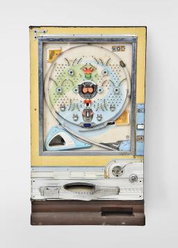 Arcade games- 2 (Two): an early mechanical (no electronics) "Big Broadcast" pinball machine playing seven balls for a penny, theme of great American cities, dated 1924, and a Japanese Pachinko gaming machine in custom case