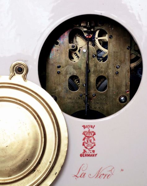 Ansonia Clock Co., New York, NY, "La Nord" Royal Bonn porcelain shelf clock with a visible escapement on an 8 days, spring driven, time and half hour strike movement, c1904.