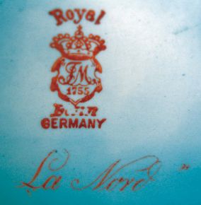 Ansonia Clock Co., New York, NY, "La Nord" Royal Bonn porcelain shelf clock with a visible escapement on an 8 days, spring driven, time and half hour strike movement, c1904.