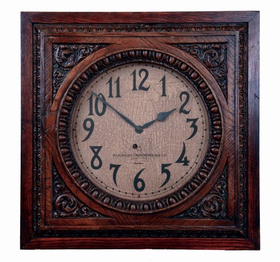 E. Ingraham & Co., Bristol, Conn., 8 days, spring driven brass movement wall timepiece made for the "Railroad Chronometer Co., Chicago". Not shown in catalogs as it was a special order. Ingraham made a square case model of the same size named the "Solar", but this model is more ornate. Movement dated Nov. 1910.
