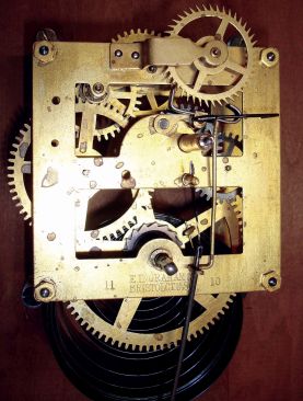 E. Ingraham & Co., Bristol, Conn., 8 days, spring driven brass movement wall timepiece made for the "Railroad Chronometer Co., Chicago". Not shown in catalogs as it was a special order. Ingraham made a square case model of the same size named the "Solar", but this model is more ornate. Movement dated Nov. 1910.