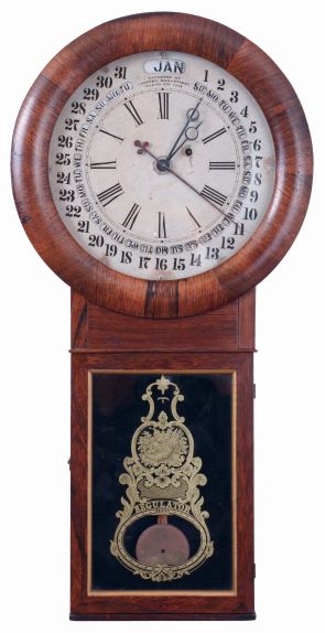 William L. Gilbert & Co., Winsted, Conn., "Round Long Drop Calendar" regulator designed by S. B. Terry while working for Gilbert, 1859-1861. 8 days, weight driven brass timepiece with Galusha Maranville patent calendar, c1862